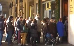 People waiting in line for Winter sales to start in italy
